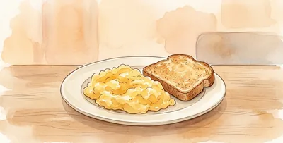 A plate of scrambled eggs with a slice of bread, on a wooden table.